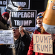 People participate in a protest against U.S. President Donald Trump on Veterans Day on November 11, 2019 in New York City.
